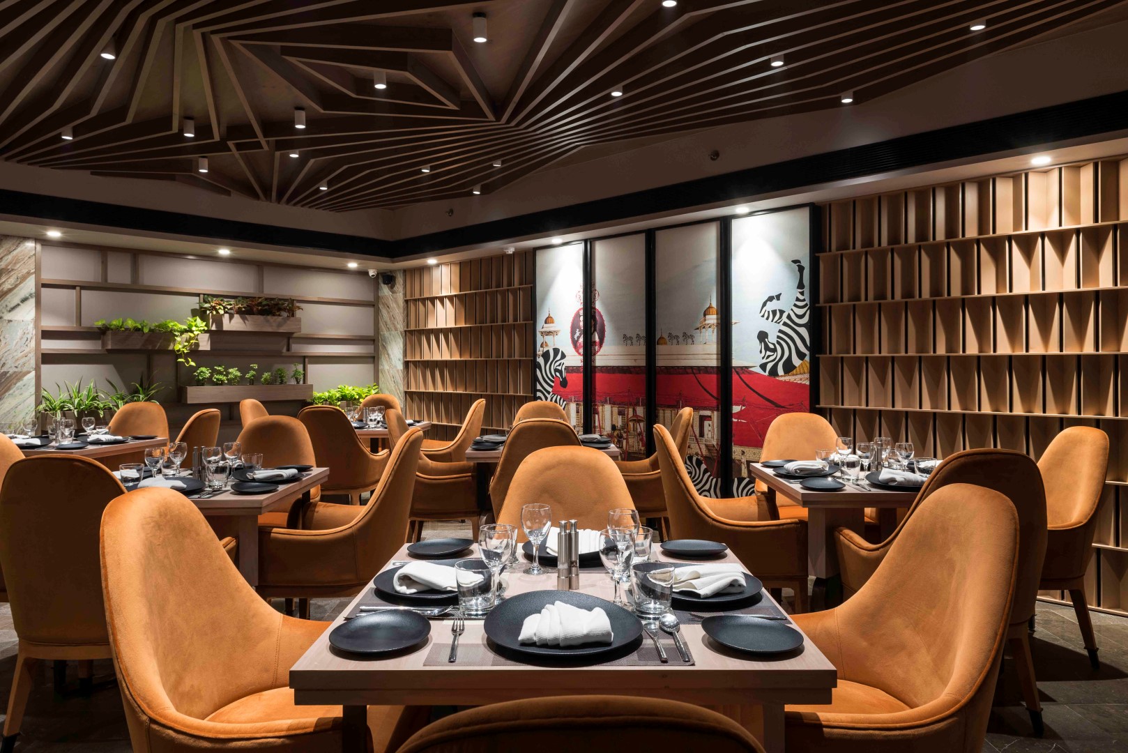 Modern restaurant interior with elegant seating, stylish decor, and lighting